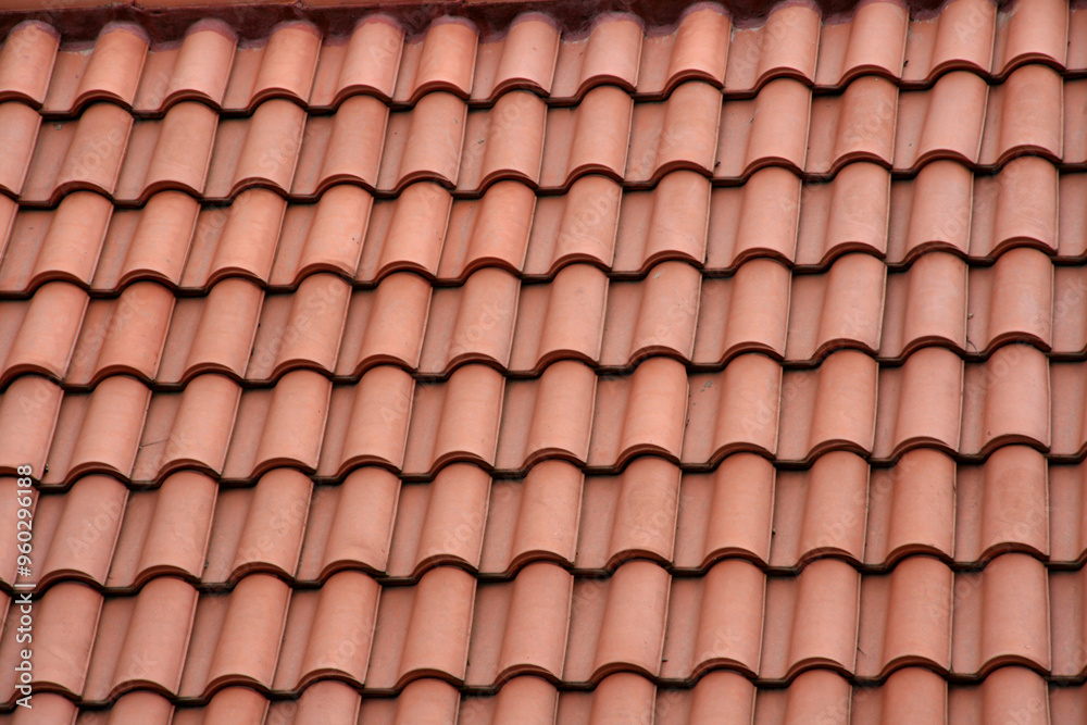 Roof made of red clay tiles. Pattern. Texture. Red tile gable roof. Background with copy space. Roof made of red clay tiles. Pattern. Texture. Red tile gable roof. Background with copy space.