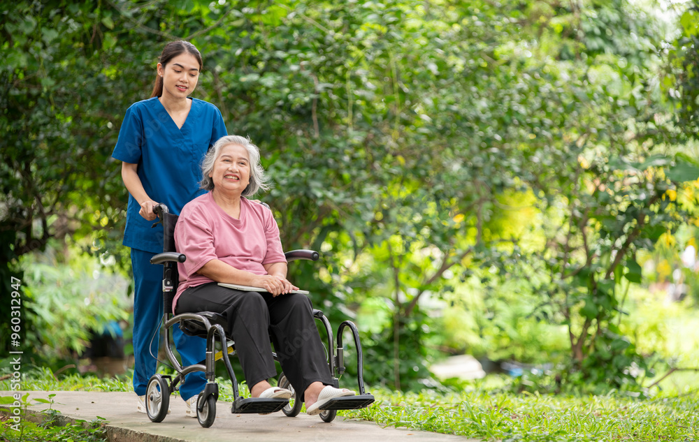 Elderly woman seated in a wheelchair with young caregiver or healthcare worker is standing behind reflects care, compassion, and a supportive relationship the caregiver and elder healthy concept. Elderly woman seated in a wheelchair with young caregiver or healthcare worker is standing behind reflects care, compassion, and a supportive relationship the caregiver and elder healthy concept.
