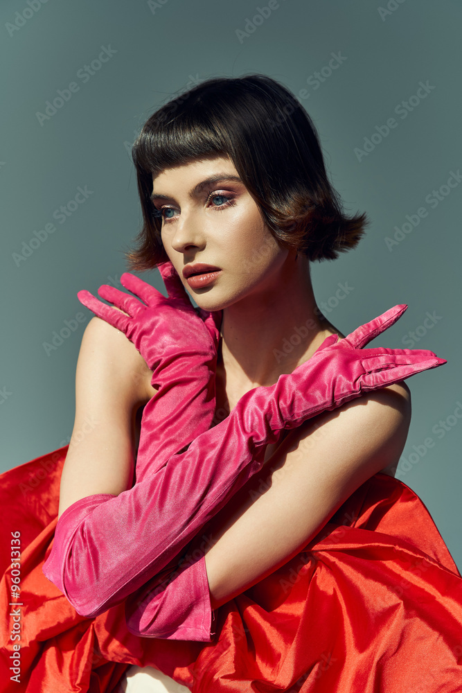 Obraz premium A stylish woman showcases her bold fashion choice with striking pose and vibrant colors.