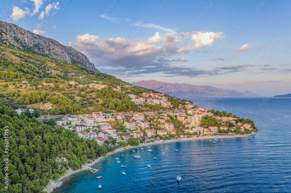 Fototapeta premium Stanici village with main beach and boats on sea near the Omis in Croatia