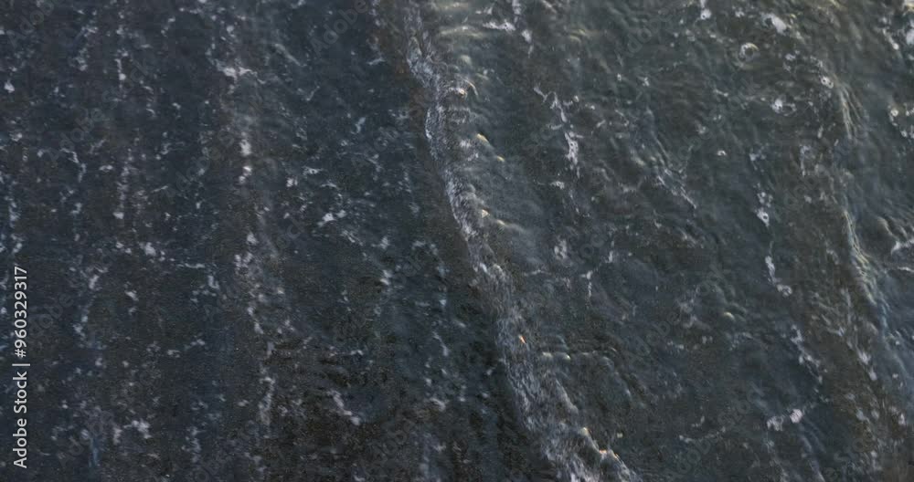 Letters of word WAR carefully written on wet sand of beach. Waves lap at shore trying to erase inscription. Sea erases letters of word Letters of word WAR carefully written on wet sand of beach. Waves lap at shore trying to erase inscription. Sea erases letters of word