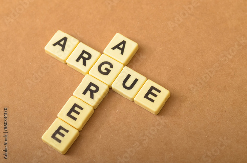 the contrast between arguing and agreeing, with the letters forming the words 