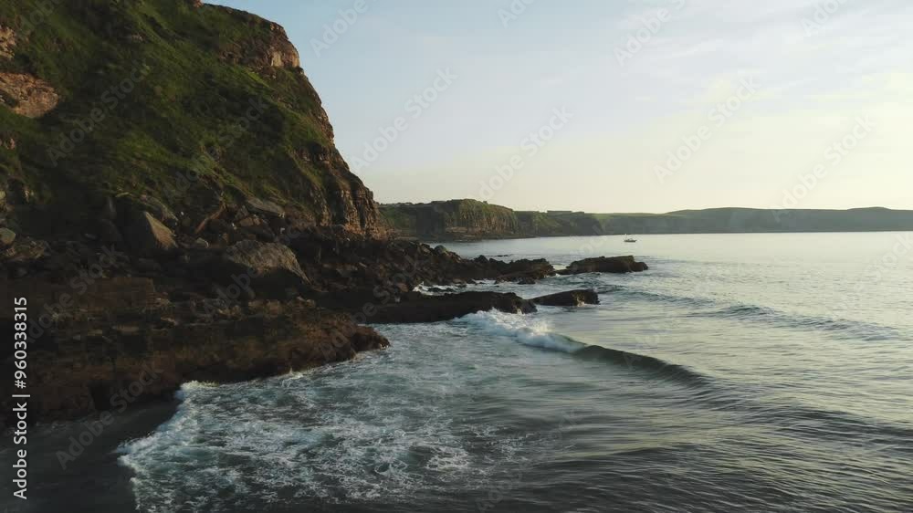 Seashore and rocky cliffs at sunset. Aerial 4k footage. Seashore and rocky cliffs at sunset. Aerial 4k footage.