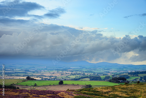 Storm Cloud over Cheviot Hills from Simonside Hills, which are covered with heather in late summer, they are part of Northumberland National Park near Rothbury, overlooking Coquetdale and Cheviot Hill photo