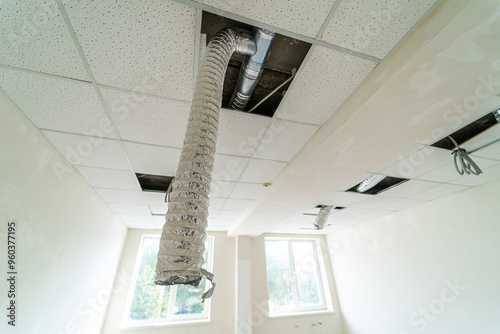 Cuadro en lienzo Ceiling repair in a room showing exposed ductwork and light fixtures