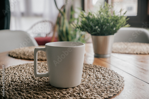 Coffee cup on wooden table in coffee shop, stock photo photo