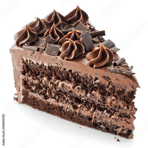 A slice of chocolate cake with chocolate frosting and chocolate shavings on a white background. photo