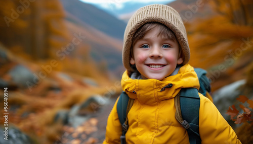 A young boy with bright eyes and rosy cheeks is bundled up in a cozy yellow jacket, standing 