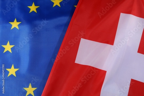 European Union and Switzerland flags displayed together in harmony photo