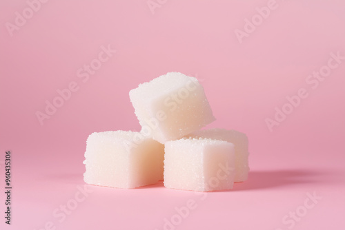 White Sugar Cubes on Pink Background