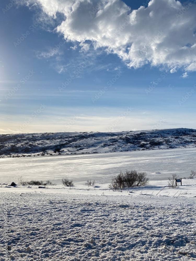 Snowy mountain, blue sky and fluffy clouds. Snowy mountain, blue sky and fluffy clouds.