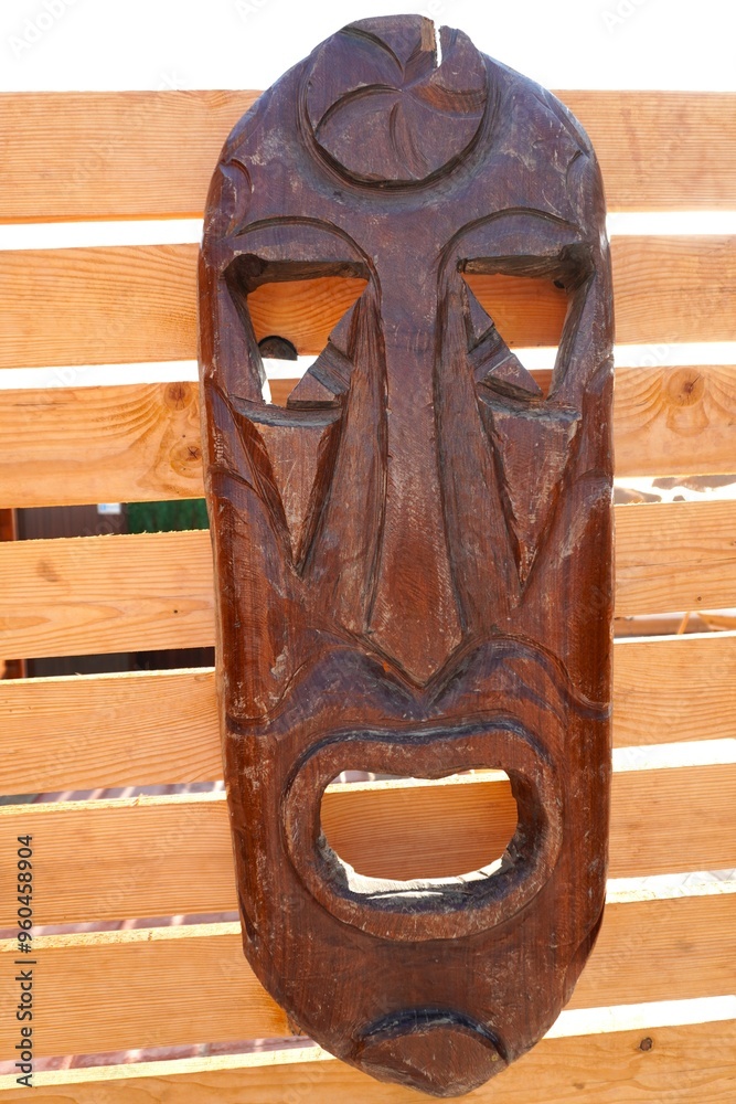 African ceremonial mask on boards. In the center of the forehead there ...