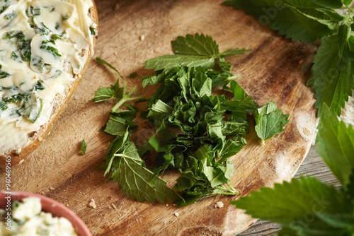 Chopped fresh nettle leaves - ingredient for nettle butter - homemade bread spread photo