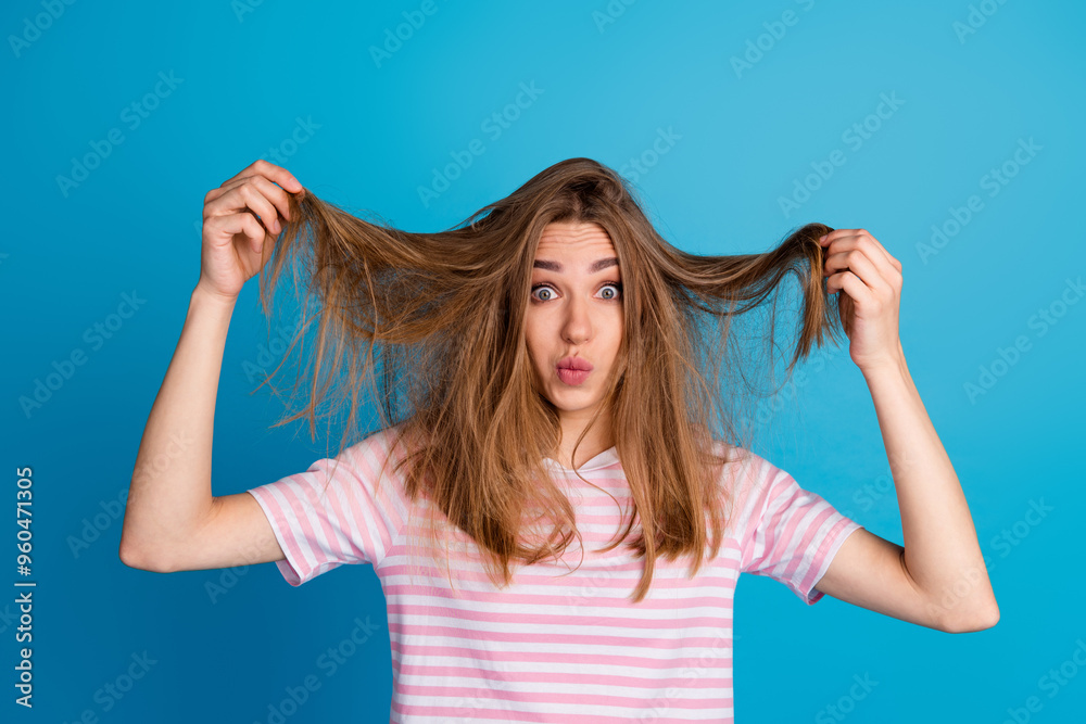 Photo of funny lovely charming woman wear trendy pink clothes isolated on blue color background Photo of funny lovely charming woman wear trendy pink clothes isolated on blue color background
