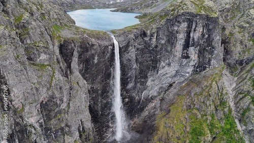 Epic waterfall in clouds zoom out drone shot, double waterfall of Mardalsfossen in Norway in 4K. photo