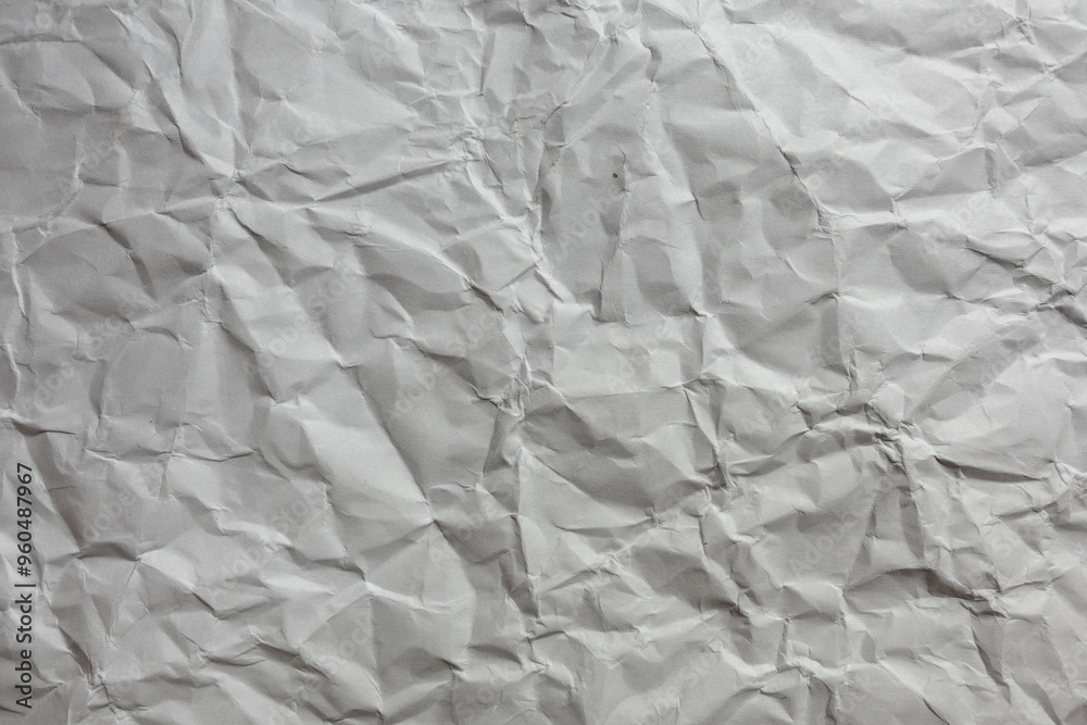 Fototapeta premium Crumpled white paper background texture