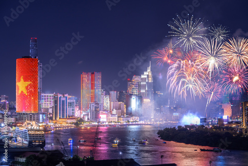 Celebration. Skyline with fireworks light up sky over business district in Ho Chi Minh City ( Saigon ), Vietnam. Beautiful night view cityscape. photo