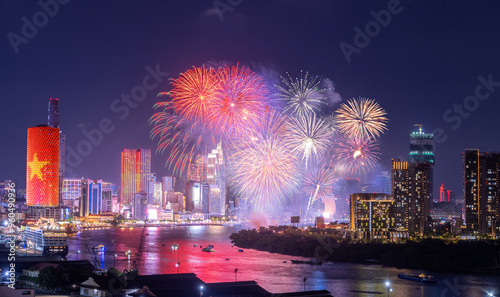 Celebration. Skyline with fireworks light up sky over business district in Ho Chi Minh City ( Saigon ), Vietnam. Beautiful night view cityscape.