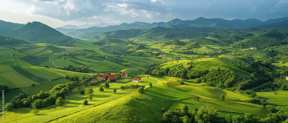 Obraz premium Peaceful Aerial Landscape of Rolling Hills and Farm Fields in the Countryside