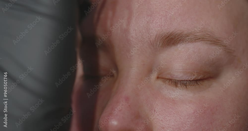 Close-up of a woman's face. The procedure for coloring and shaping eyebrows