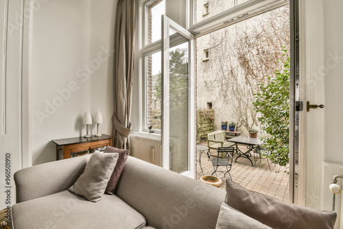 Cozy Living Room with Open French Doors to Garden