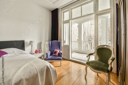 Elegant bedroom with balcony access and classic decor