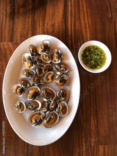 Steamed Clams with Chili Lime Sauce on White Plate photo