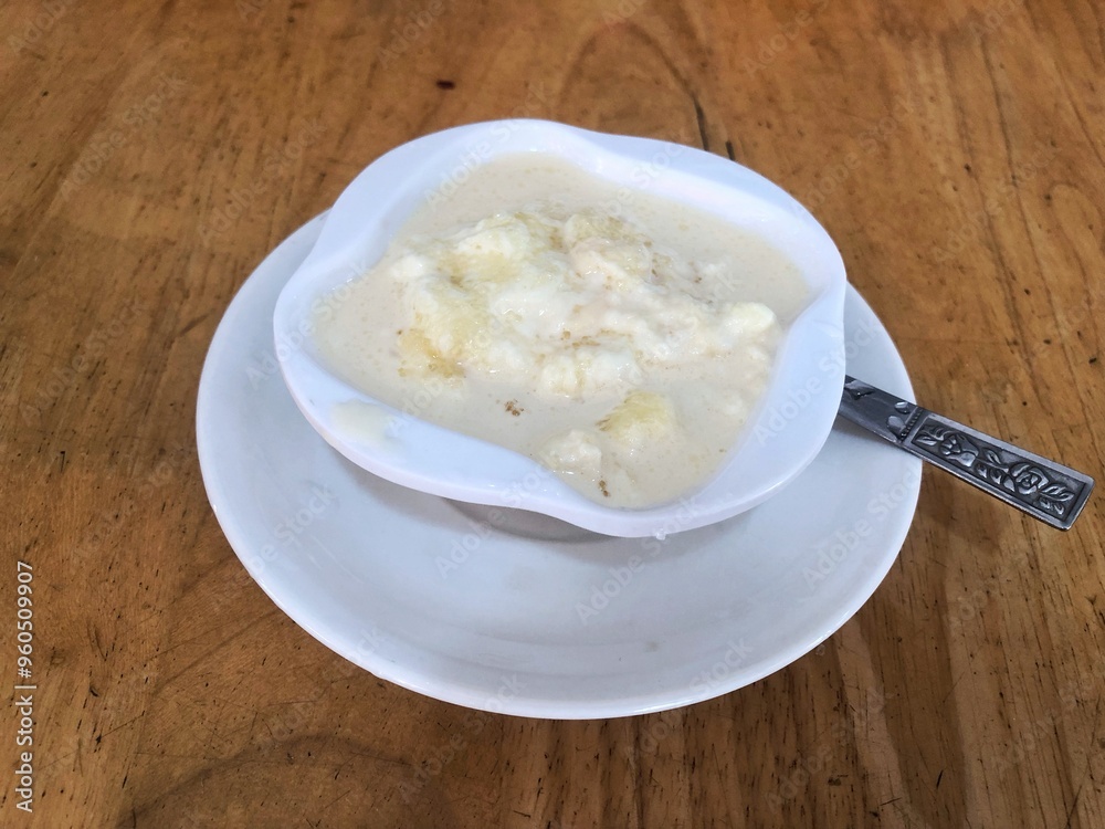 Fresh Cream in a White Bowl on Wooden Tabletop Fresh Cream in a White Bowl on Wooden Tabletop