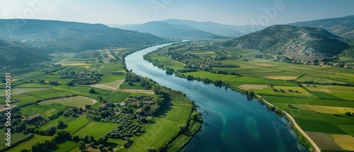 Serene Aerial View of Scenic Rural Landscape with River, Fields, and Villages in Detail