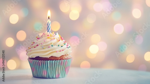 Birthday cupcake with one candle on a light background