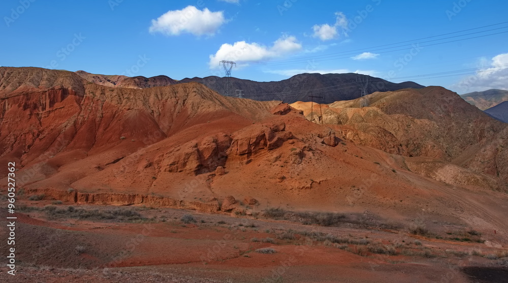 Northern Kyrgyzstan. Picturesque winding trails of the Kok Moinok canyons with red-brown rock along the Chu River. Northern Kyrgyzstan. Picturesque winding trails of the Kok Moinok canyons with red-brown rock along the Chu River.