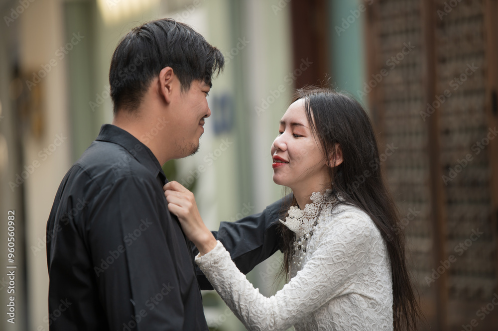 Asian young couple looking each other and spending time together Asian young couple looking each other and spending time together