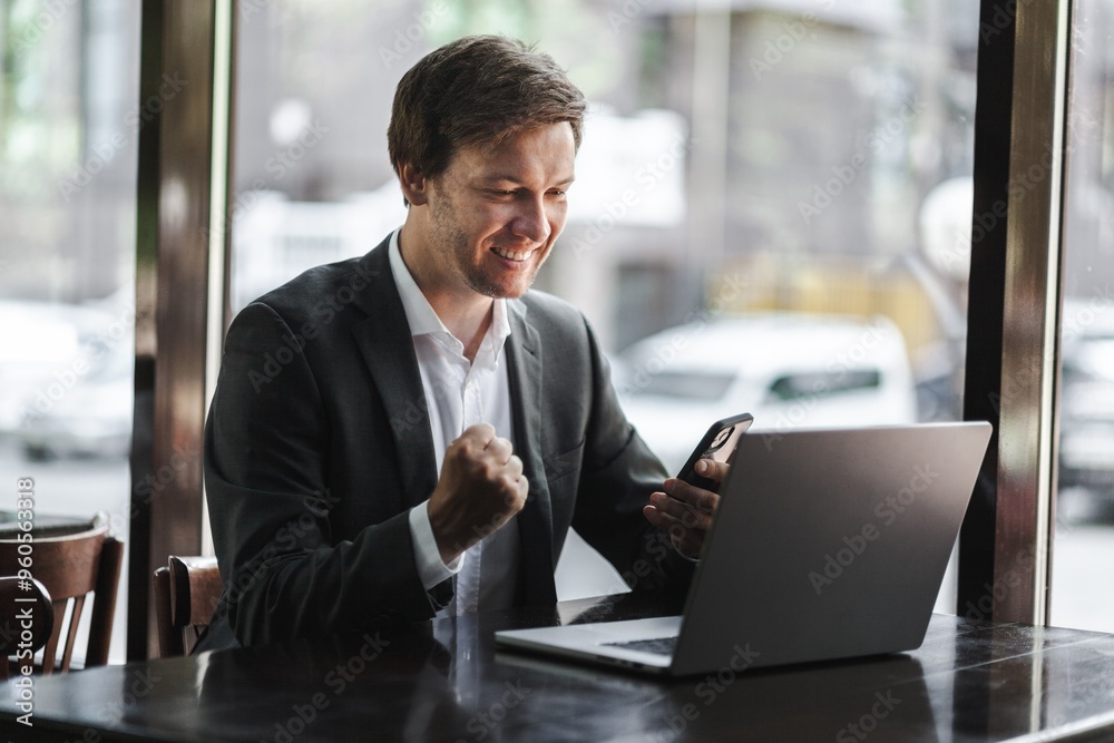 Young successful businessman at workplace office Young successful businessman at workplace office