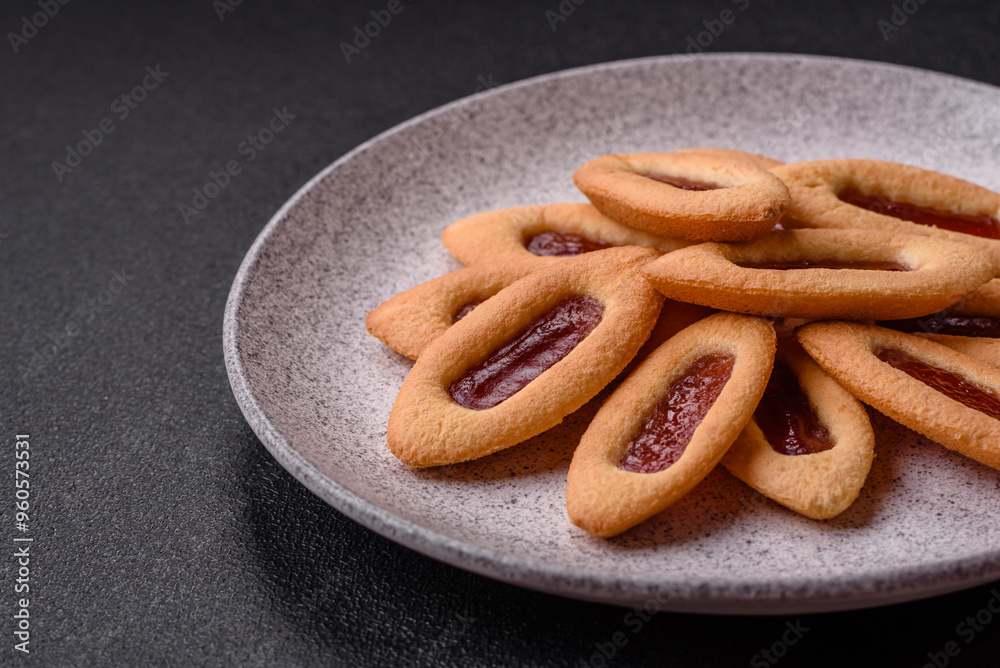Delicious sweet crispy cookies with jam filling in the center Delicious sweet crispy cookies with jam filling in the center