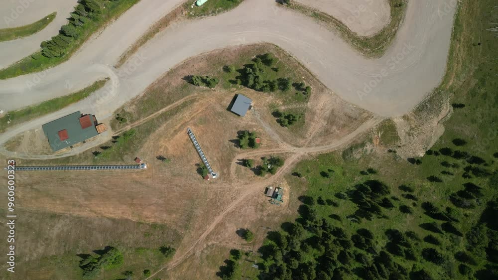 Top down aerial of dirt parking lot at base of Bridger Bowl ski resort in Montana Top down aerial of dirt parking lot at base of Bridger Bowl ski resort in Montana