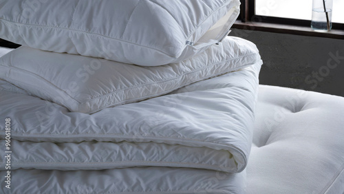 Closeup of duvets and bed sheets.