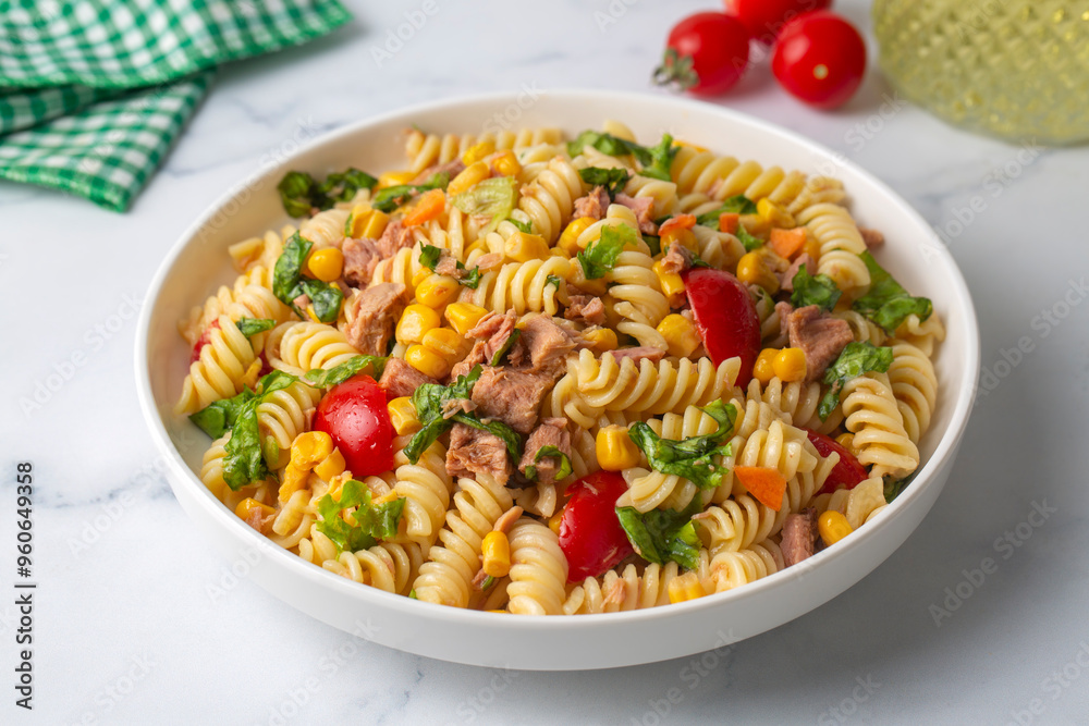 Homemade macaroni salad with trivelle pasta and canned tuna, carrot, Head Lettuce, tomato, corn and mayonnaise