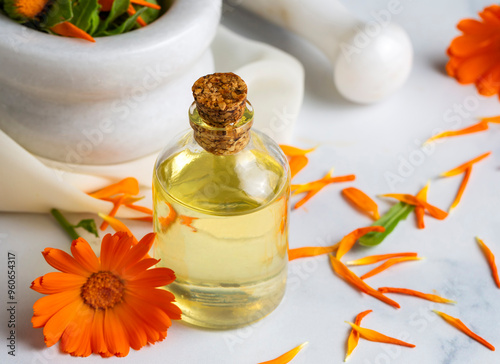 Obraz na płótnie Herbal calendula officinalis in the glass and drop oil. Calendula oil. w salonie
