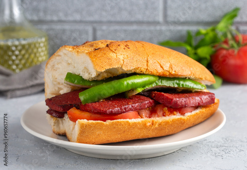 Sausage with bread on a wooden background. Turkish name; Sucuk ekmek - ekmek arası sucuk