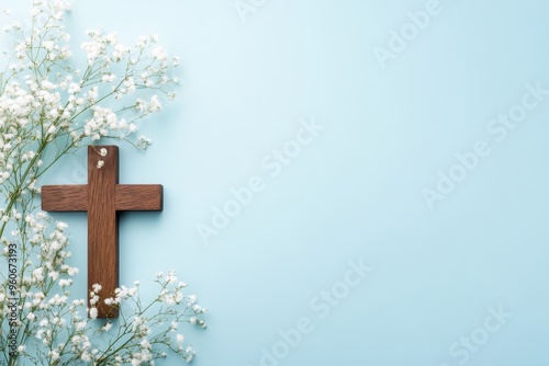 a wooden cross and white flowers on a light blue background, representing a Christian funeral service Generative AI