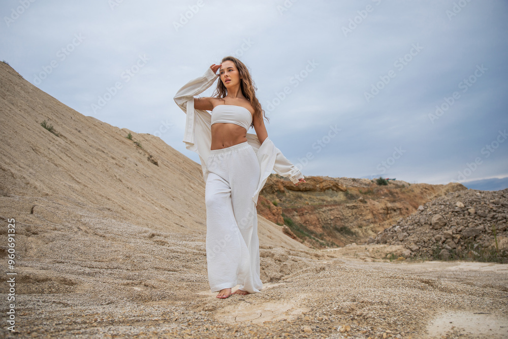 Full length portrait of a young woman posing in the Padovskiy quarry Full length portrait of a young woman posing in the Padovskiy quarry