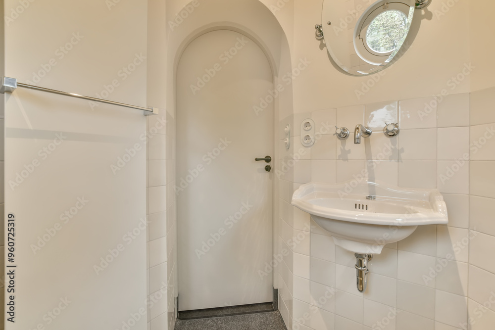 Compact and bright white-tiled bathroom interior Compact and bright white-tiled bathroom interior