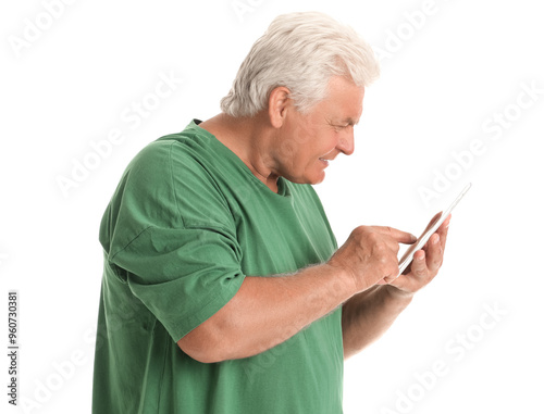 Senior man using tablet com...