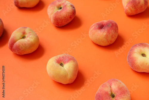 Sweet fig peaches on orange background photo