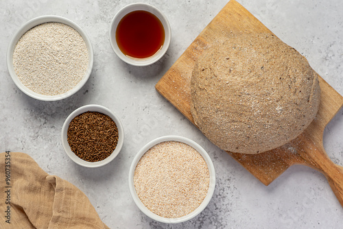 Food photography of whole grain rye and wheat sourdough bread, fermented raw dough, caraway seed, malt, grain, nutritional