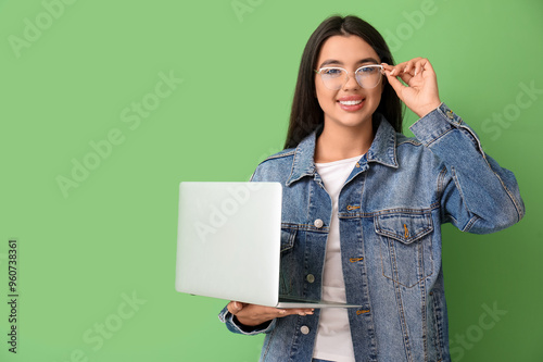 Happy female programmer wit...
