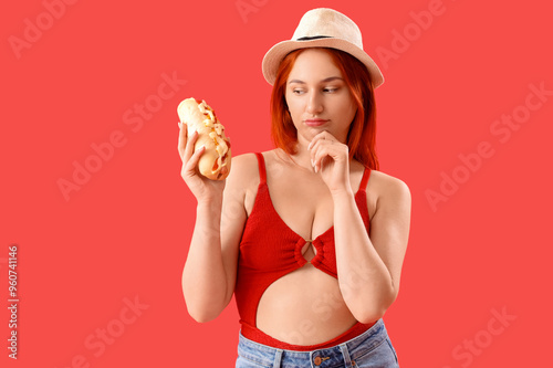 Thoughtful young woman with...