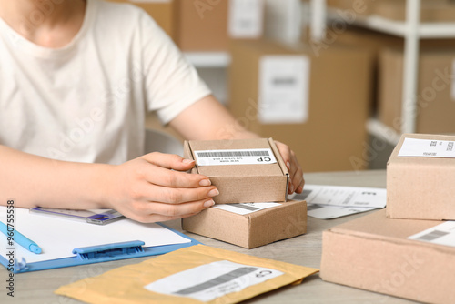 Female postal worker with p...