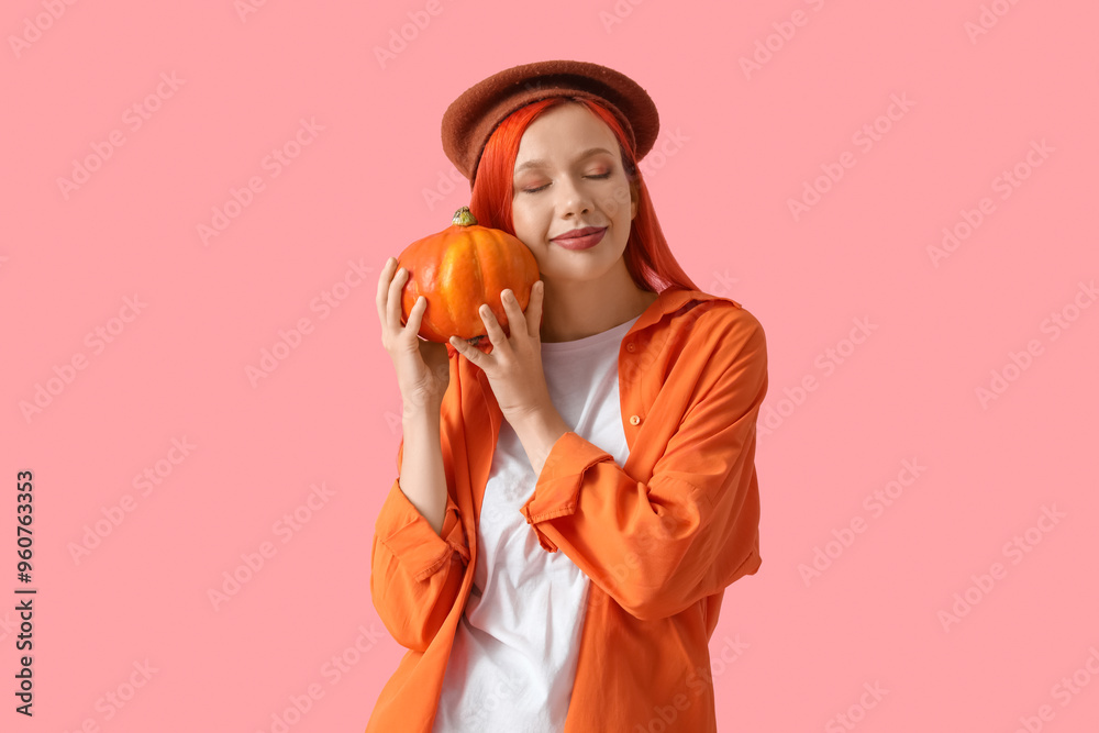 Beautiful young happy woman in beret with pumpkin on pink background Beautiful young happy woman in beret with pumpkin on pink background