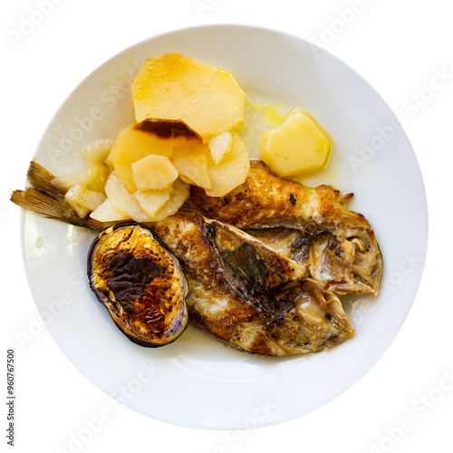 Simple and hearty rustic lunch - baked whole dorado sea fish, garnished with boiled potatoes and baked eggplant. Isolated over white background photo